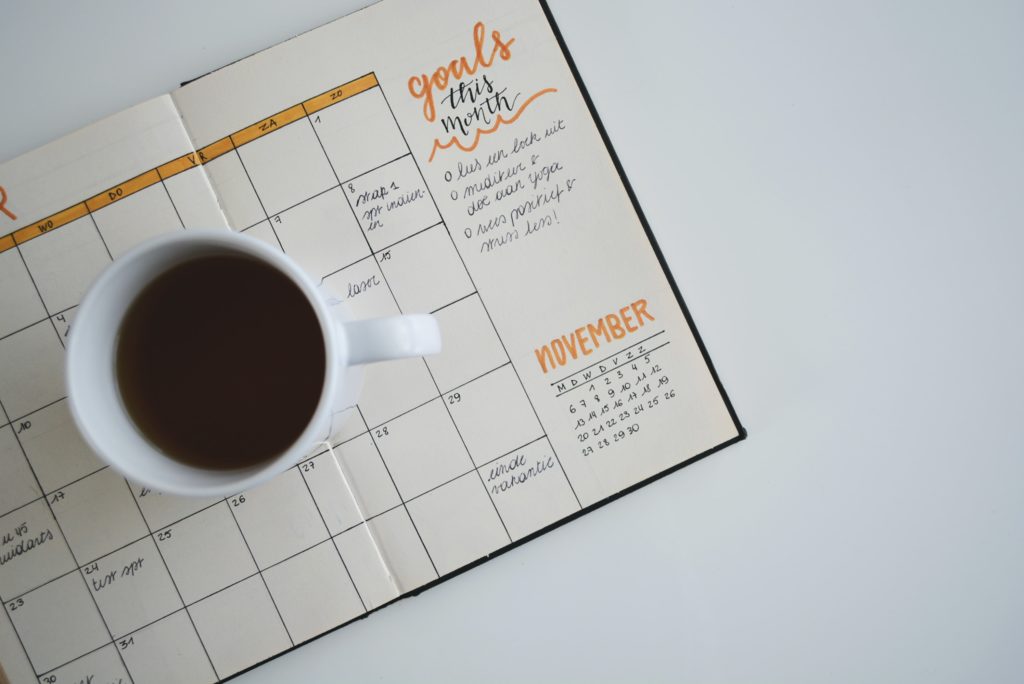 Coffee cup on a calendar in a diary