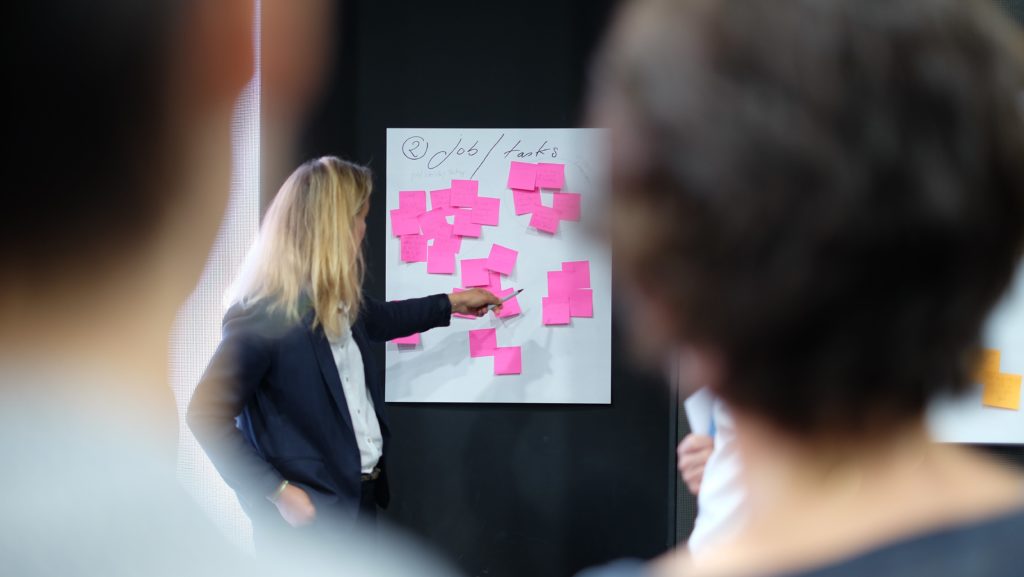 Woman pointing to agile task board