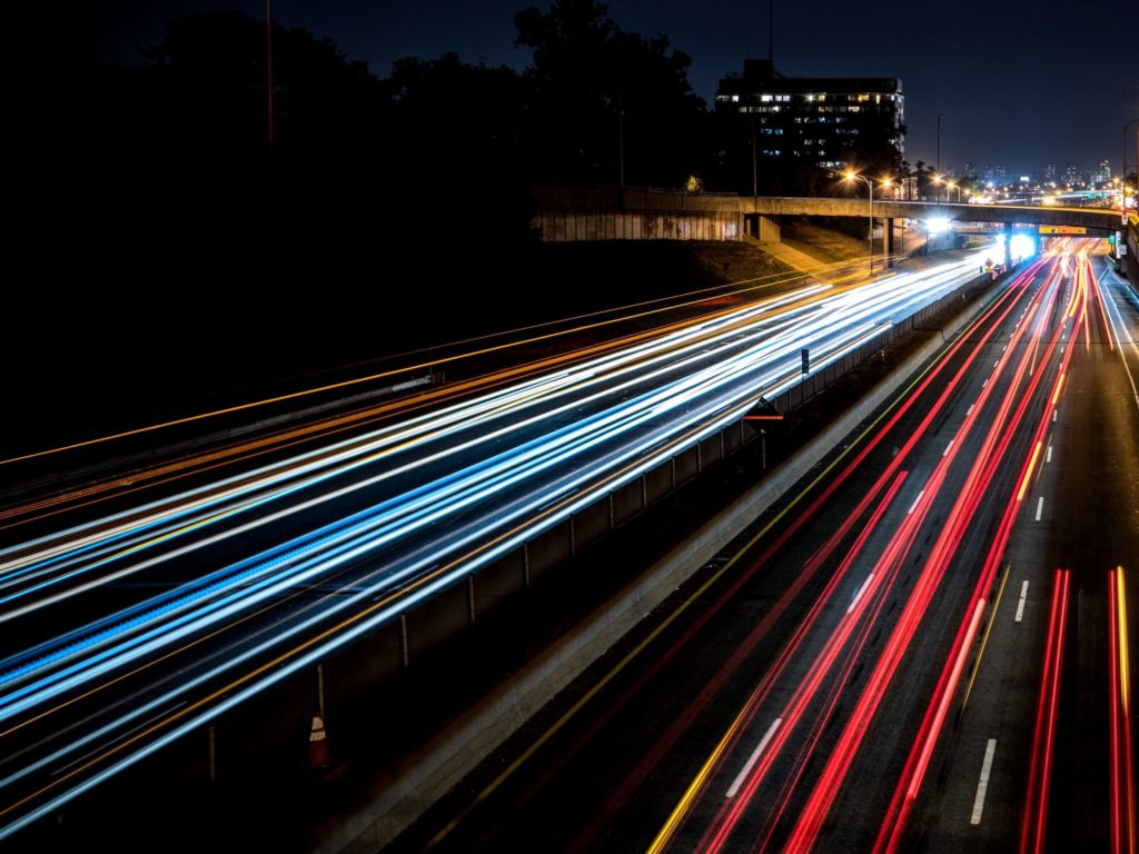 Long exposure photograph of cars on a highway at night